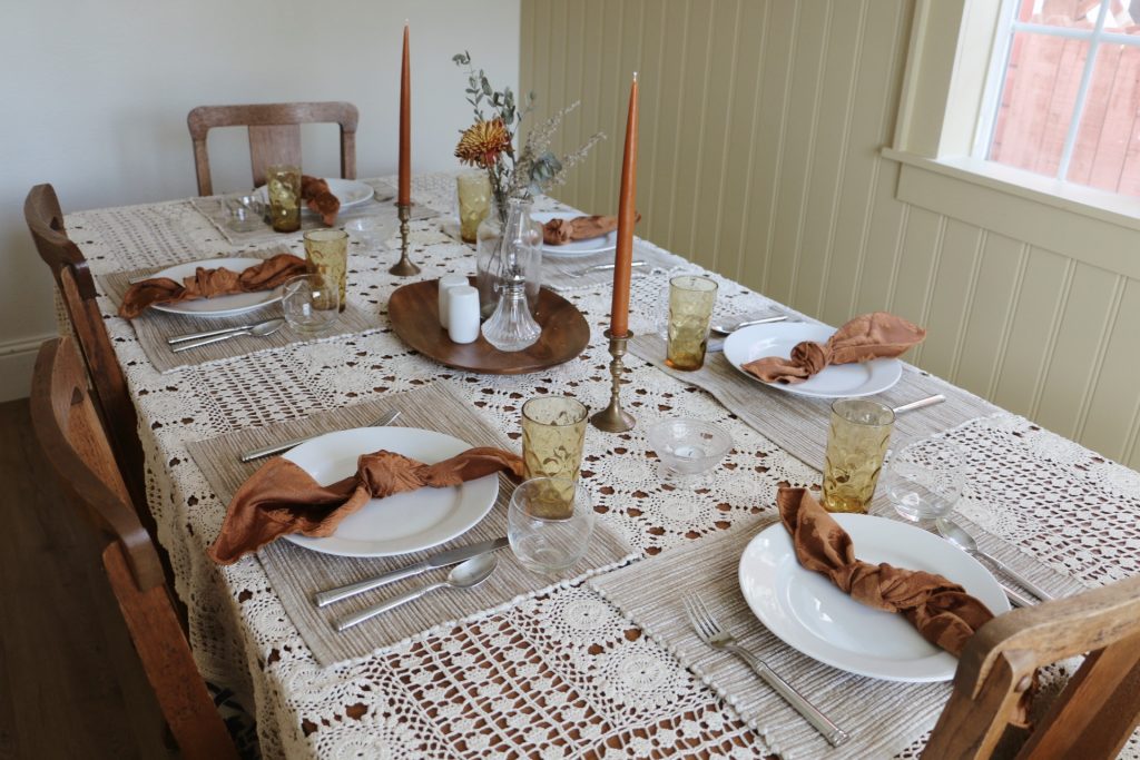 thanksgiving table with thrifted items and place settings