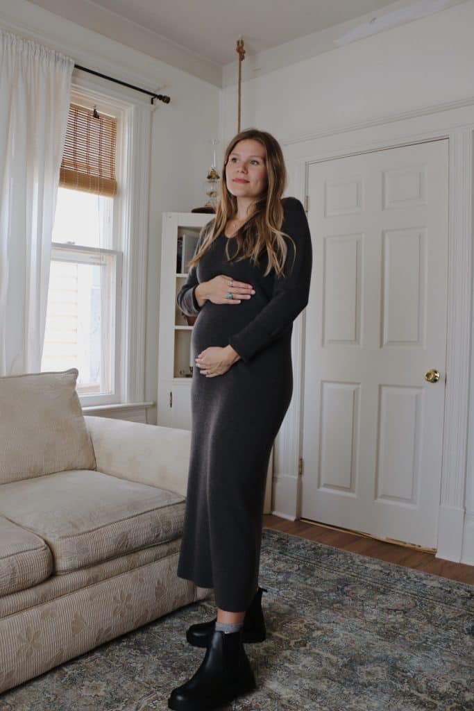 pregnant woman wearing long charcoal knit dress