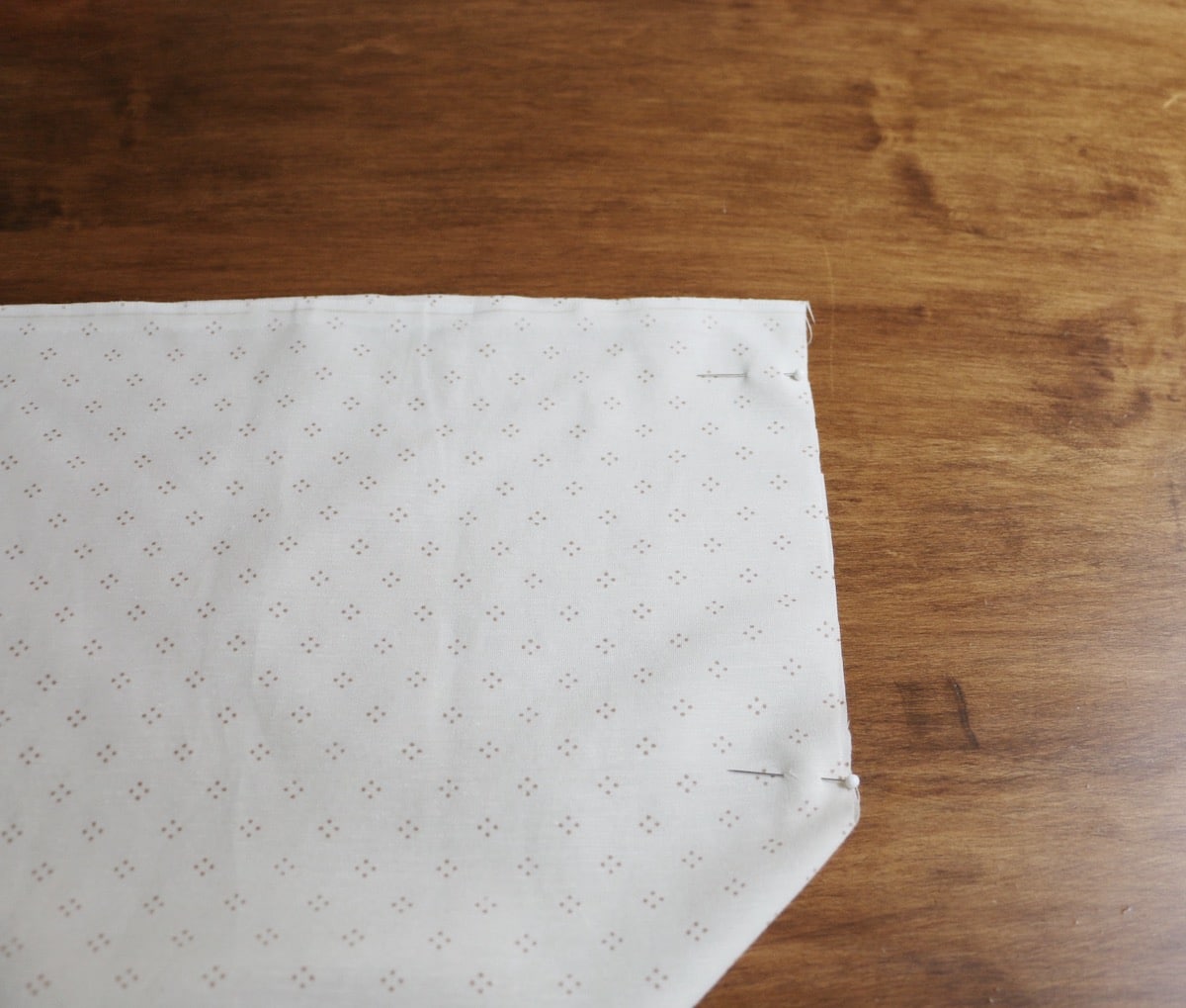 fabric pinned on wood table