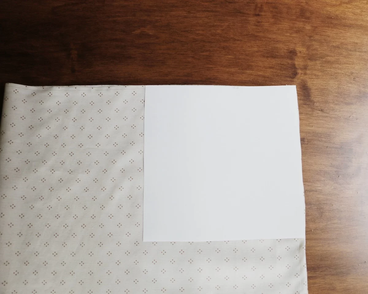 white square on fabric on wood table